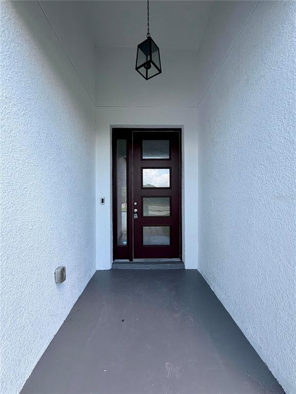 14142 Appleton Boulevard Port Charlotte, FL 33981 - Photo 3 of 26 a view of an empty room with a window
