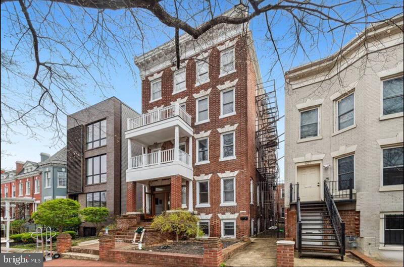 a front view of a building with a street