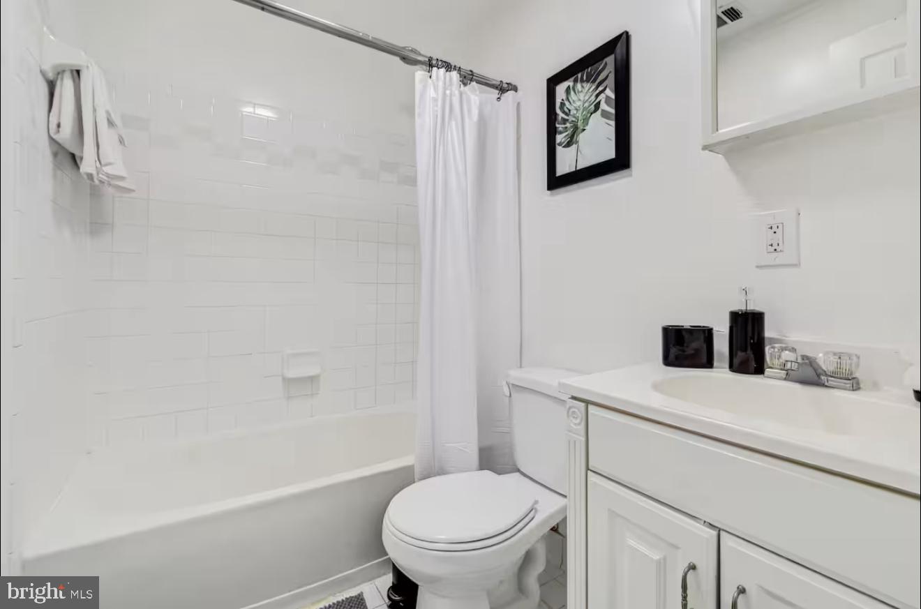 623 5th Street Northeast, Unit 6 Washington, DC 20002 - Photo 15 of 15 a bathroom with a sink a toilet and a bathtub
