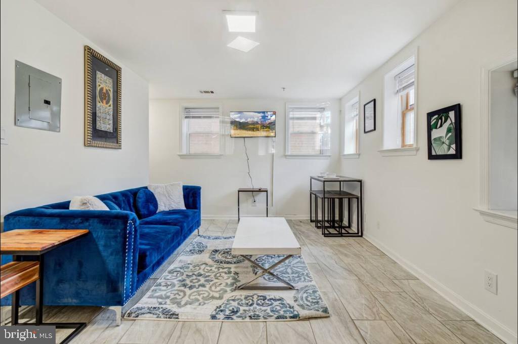 623 5th Street Northeast, Unit 6 Washington, DC 20002 - Photo 5 of 15 a living room with furniture and wooden floor