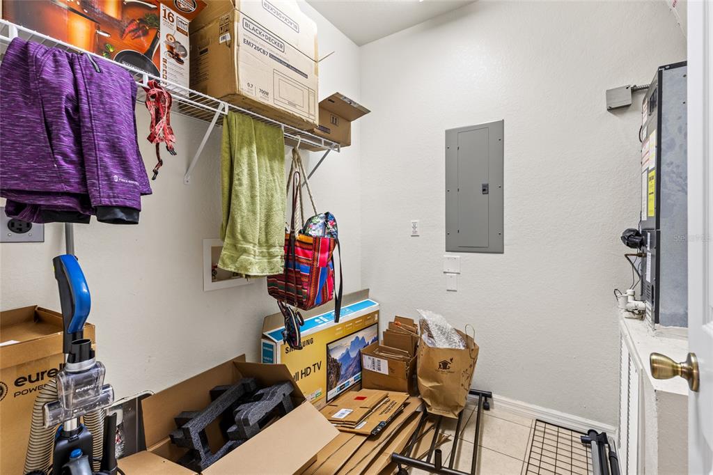 1573 Northwest 29 Road, Unit 3 Gainesville, FL 32605 - Photo 20 of 20 a view of walk in closet with clothes and shoes