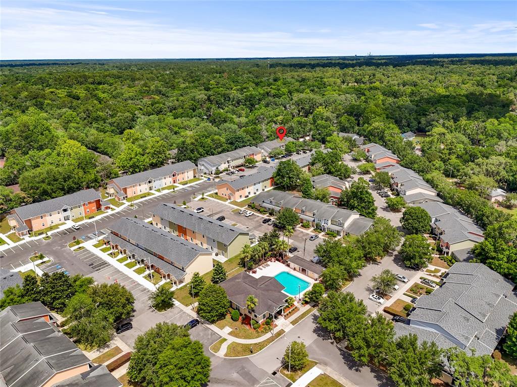 1573 Northwest 29 Road, Unit 3 Gainesville, FL 32605 - Photo 5 of 20 an aerial view of residential houses with outdoor space