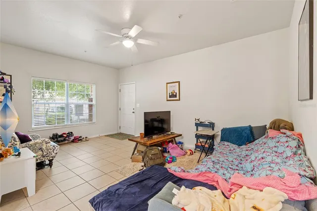 a bedroom with furniture toys and a chandelier