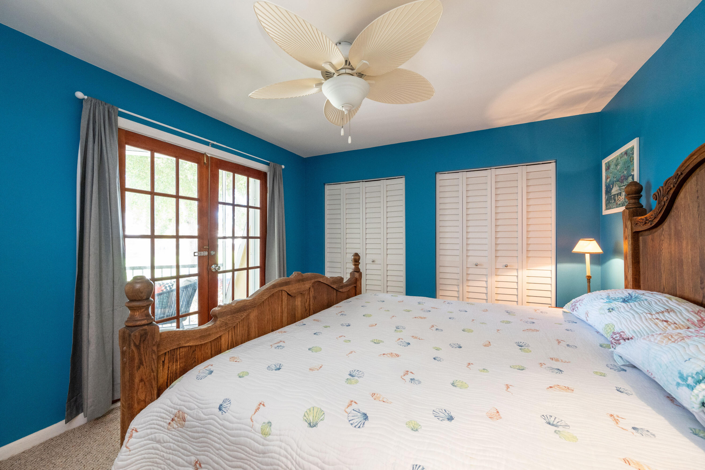 3200 Eagle Avenue Key West, FL 33040 - Photo 13 of 25 a bedroom with a large bed and a large window