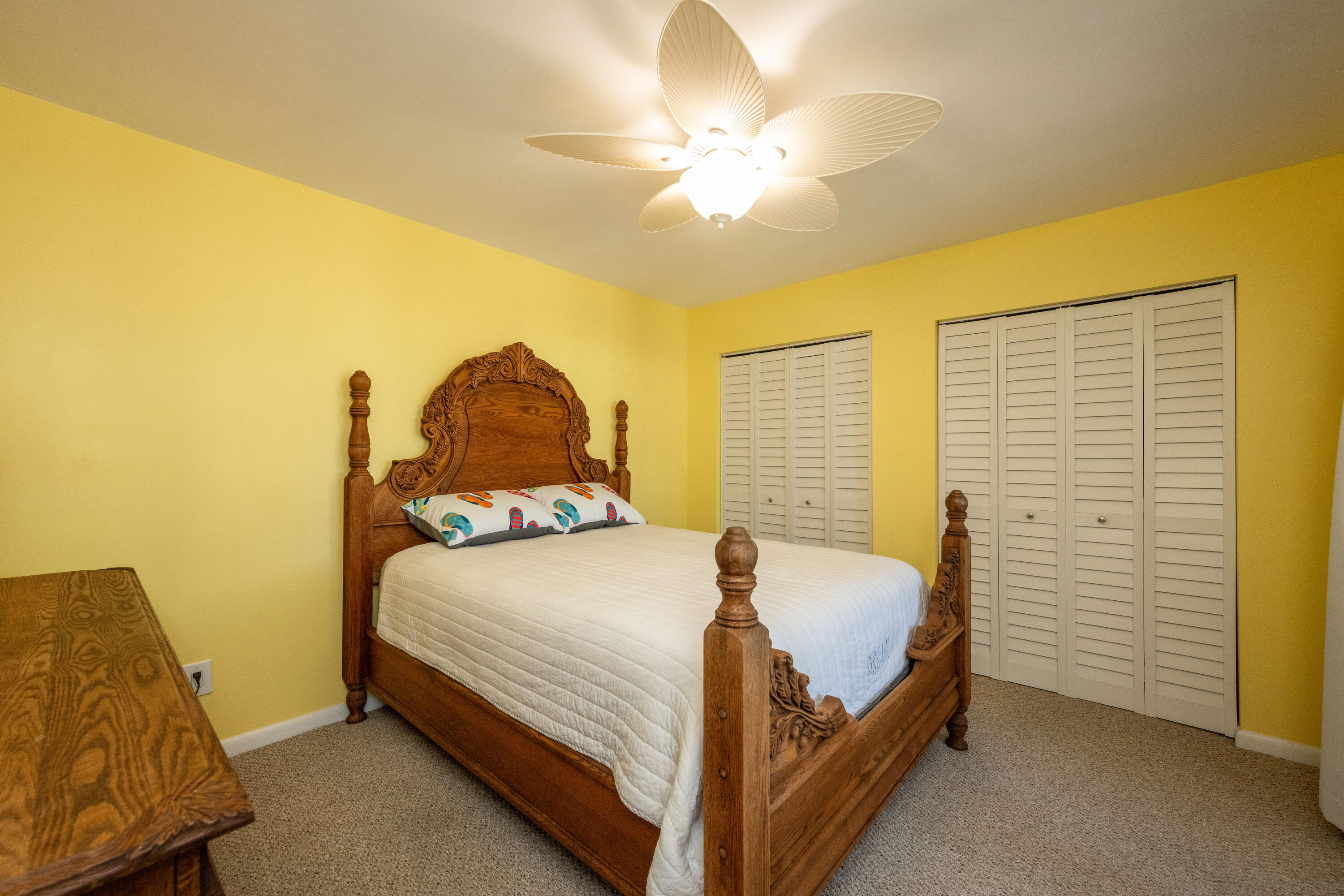 3200 Eagle Avenue Key West, FL 33040 - Photo 22 of 25 a bedroom with a bed and a chandelier