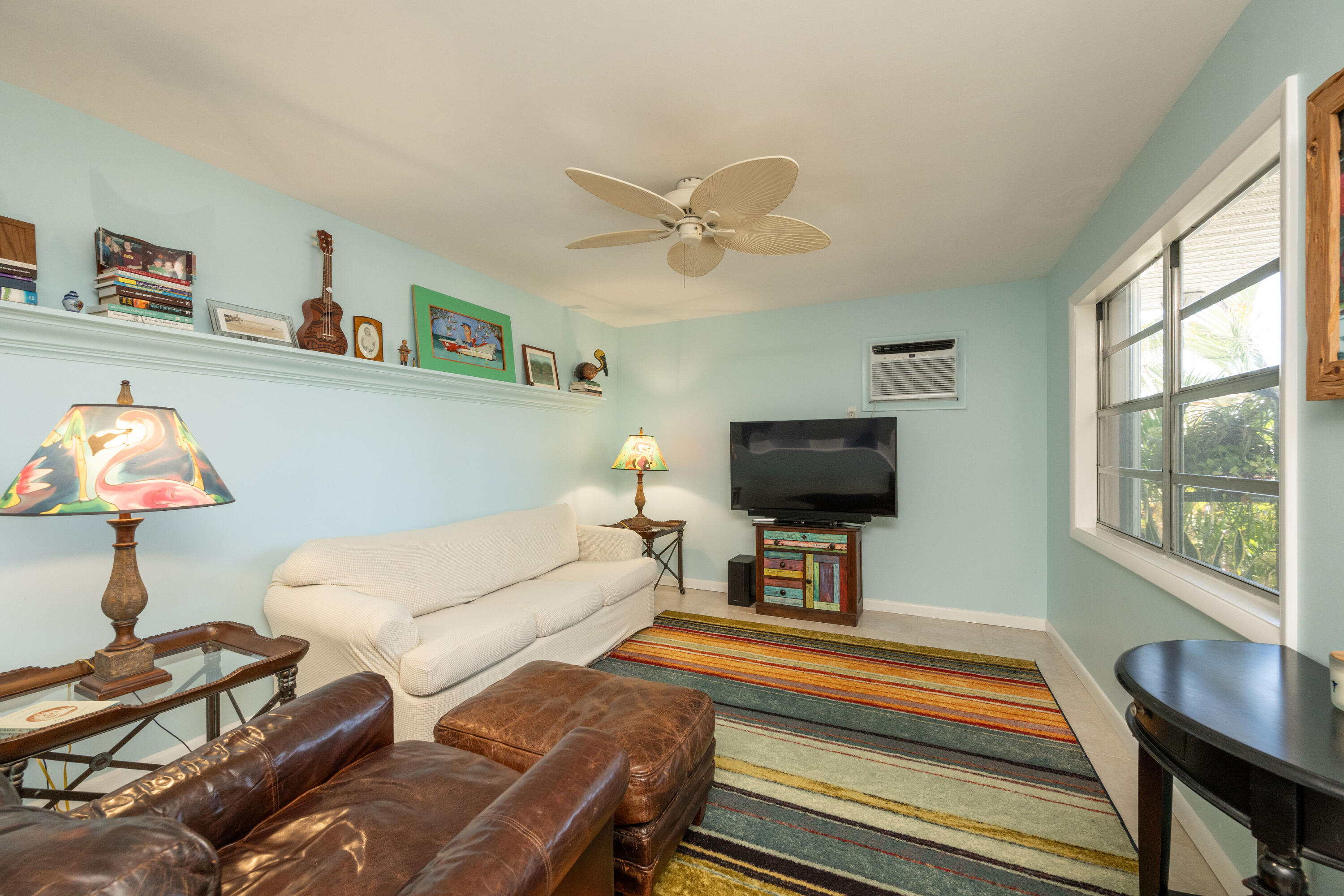 3200 Eagle Avenue Key West, FL 33040 - Photo 4 of 25 a living room with furniture and a flat screen tv with wooden floor