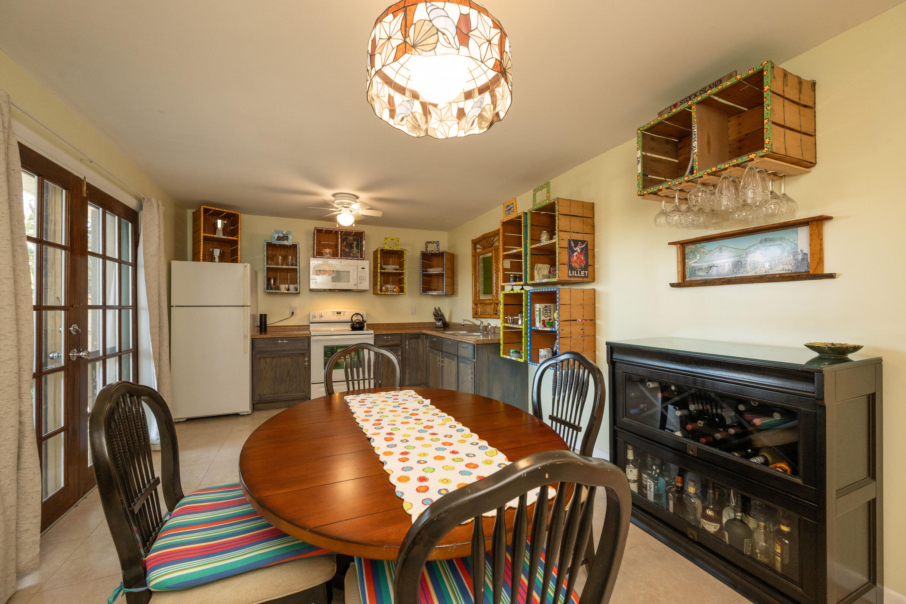 3200 Eagle Avenue Key West, FL 33040 - Photo 6 of 25 a view of a dining room with furniture and a chandelier