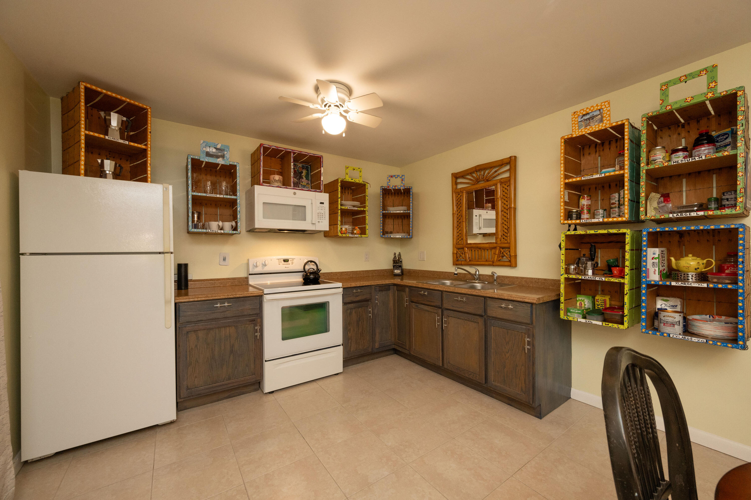 3200 Eagle Avenue Key West, FL 33040 - Photo 9 of 25 a kitchen with stainless steel appliances granite countertop a refrigerator and a sink