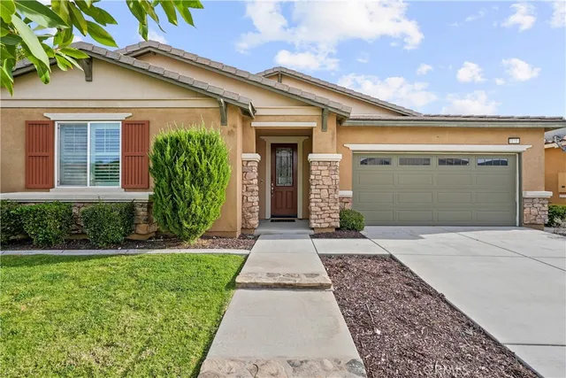 front view of a house with a yard