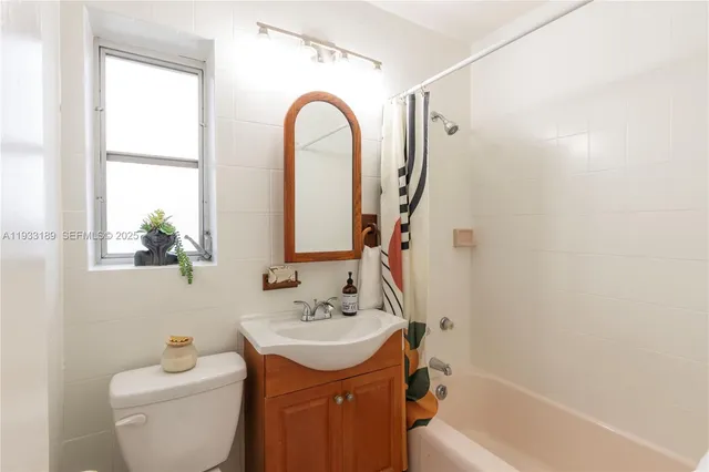 a bathroom with a sink a toilet and a bathtub