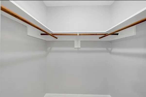 a view of an empty walk in closet