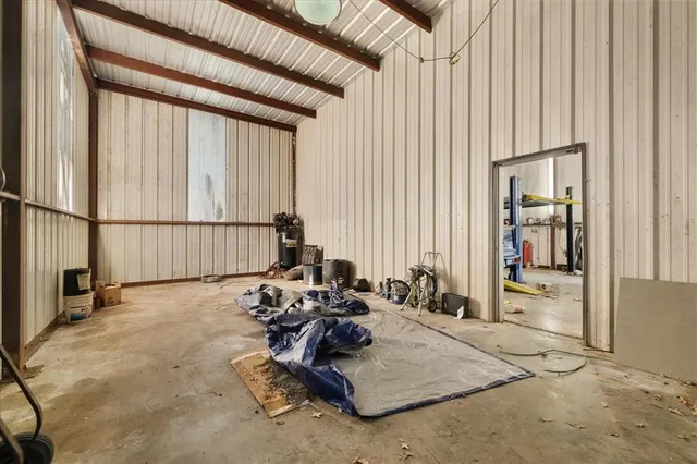 a room with gym equipment and a large window