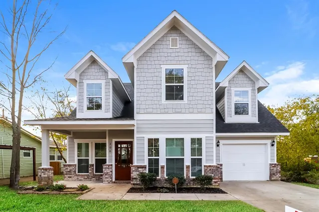 a front view of a house with garden