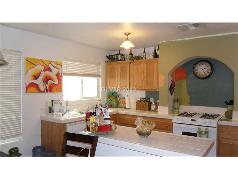 7322 Linaria Road Las Vegas, NV 89113 - Photo 3 of 29 Kitchen. Sunny kitchen. Kitchen walls will be fresh painted.