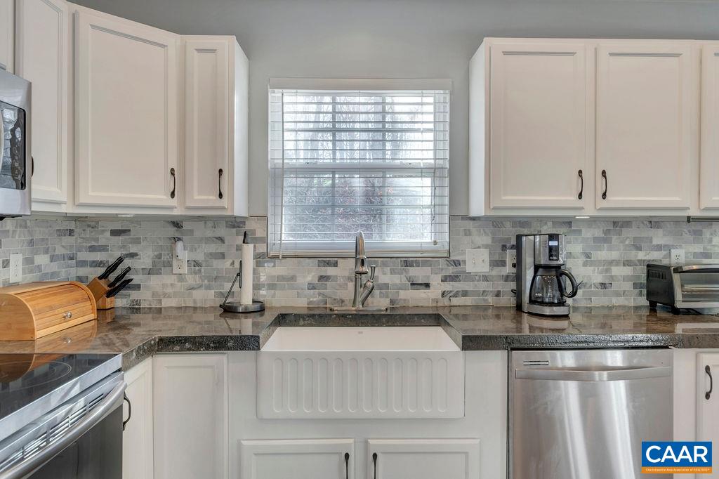 27 Zephyr Road Palmyra, VA 22963 - Photo 14 of 34 a kitchen with stainless steel appliances granite countertop a sink a stove and a granite counter tops