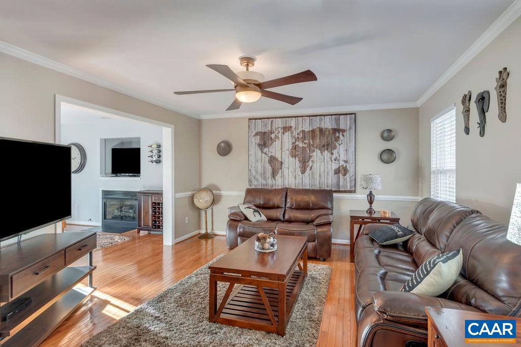 27 Zephyr Road Palmyra, VA 22963 - Photo 8 of 34 a living room with furniture and a flat screen tv