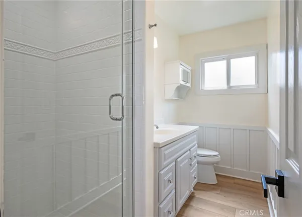 a bathroom with a sink toilet and vanity