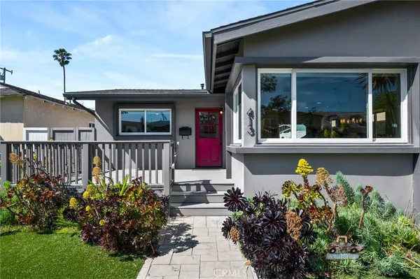 a view of a house with wooden deck