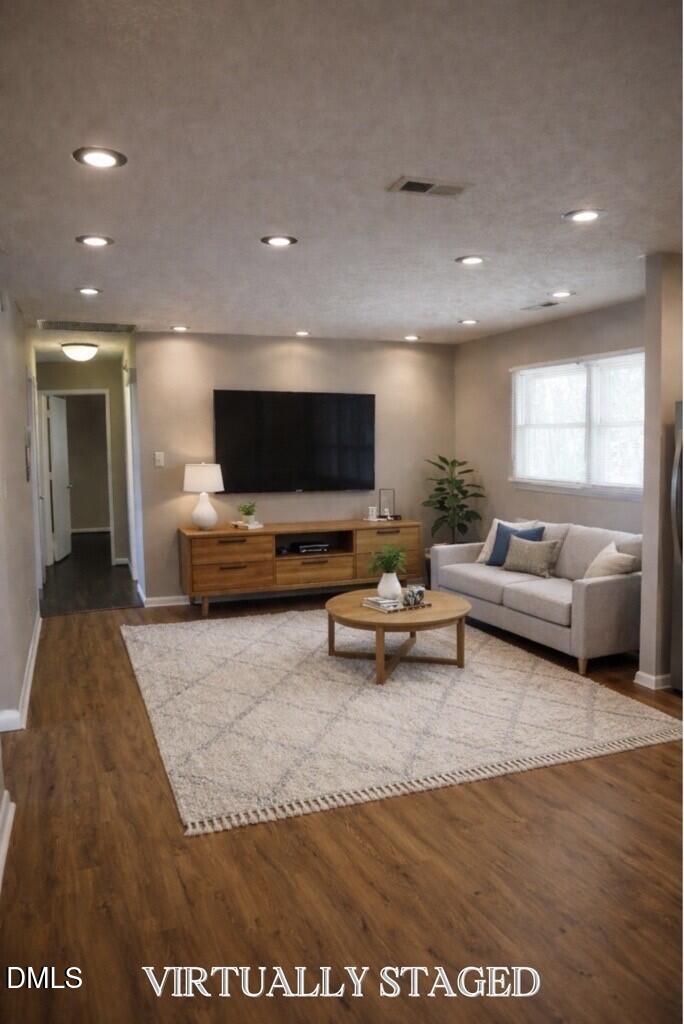 6591 Goldsboro Road Wade, NC 28395 - Photo 12 of 33 a living room with furniture and a flat screen tv