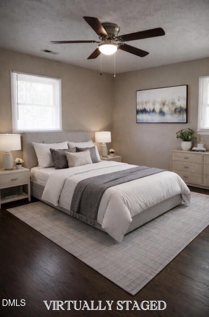 6591 Goldsboro Road Wade, NC 28395 - Photo 15 of 33 a bedroom with a large bed and a chandelier