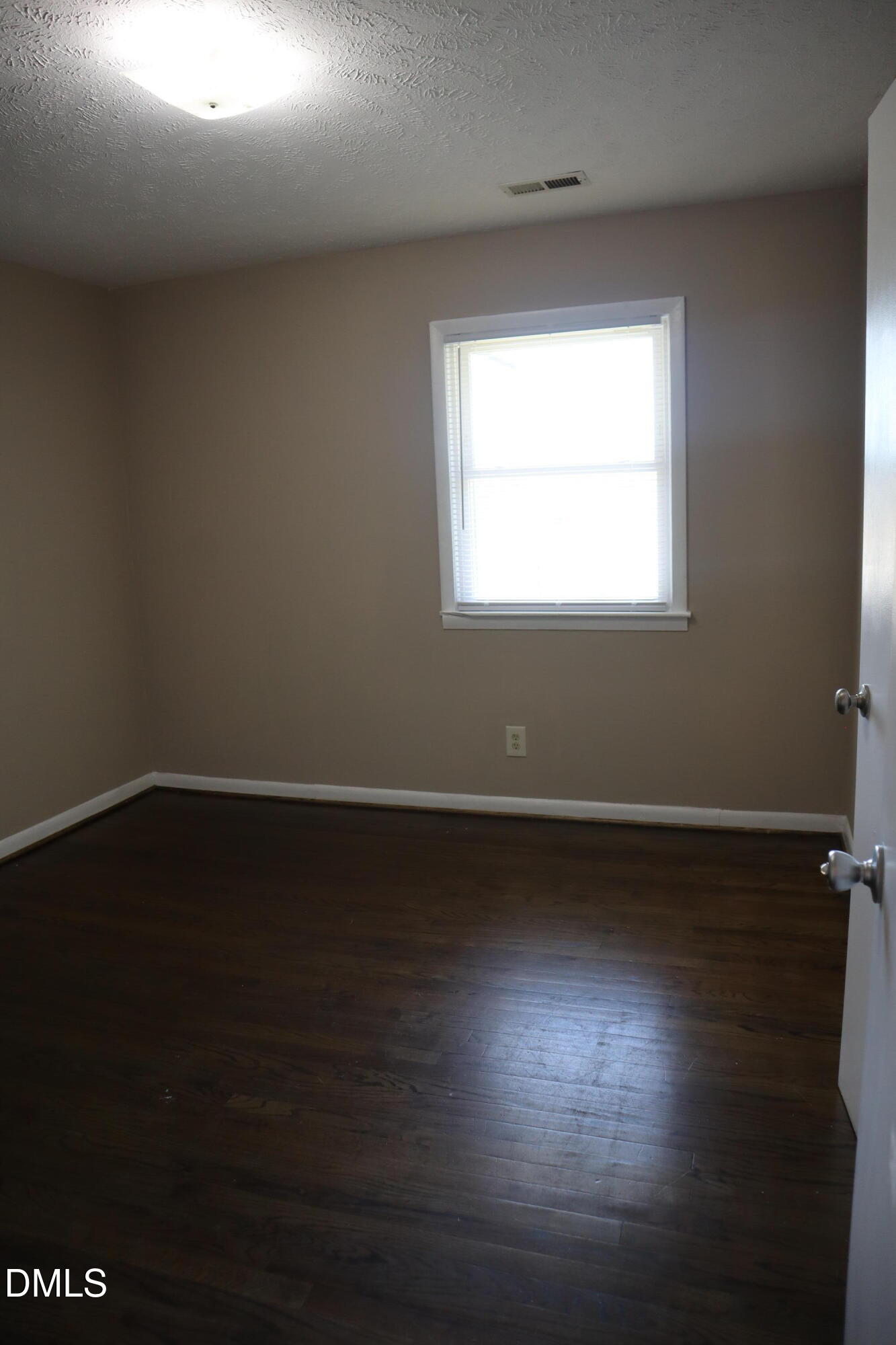 6591 Goldsboro Road Wade, NC 28395 - Photo 19 of 33 a view of wooden floor and windows in a room