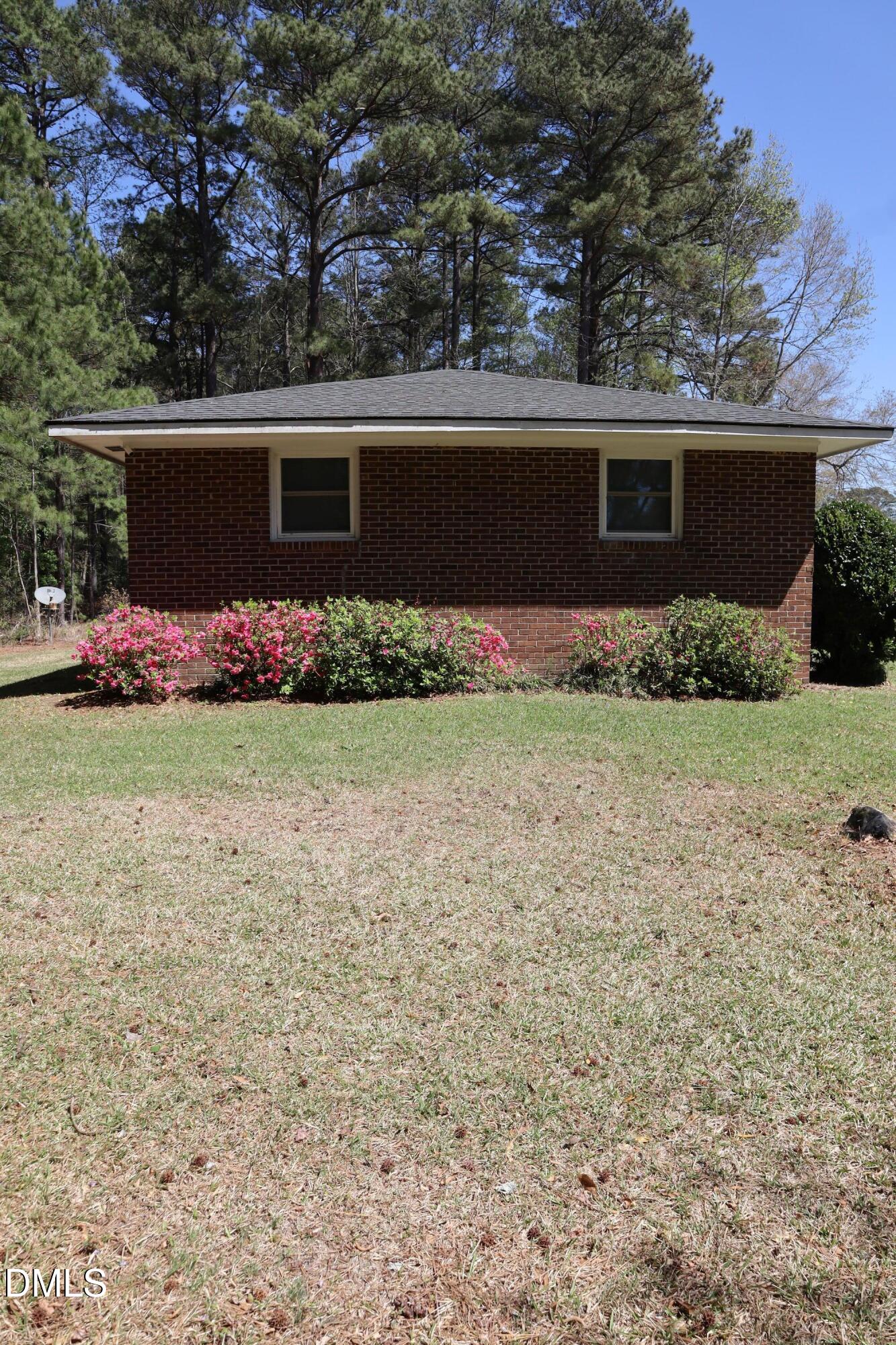 6591 Goldsboro Road Wade, NC 28395 - Photo 31 of 33 front view of house with a yard
