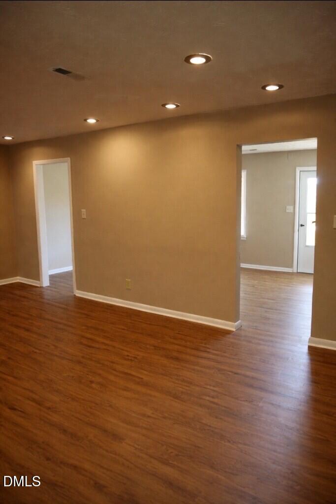 6591 Goldsboro Road Wade, NC 28395 - Photo 8 of 33 a view of an empty room with wooden floor