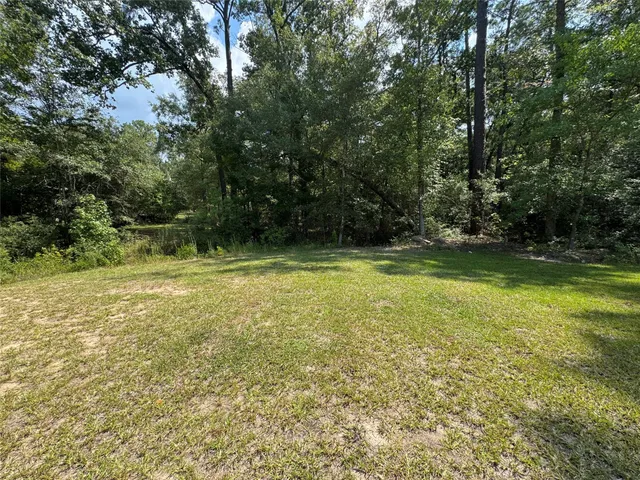 a view of outdoor space with deck and yard