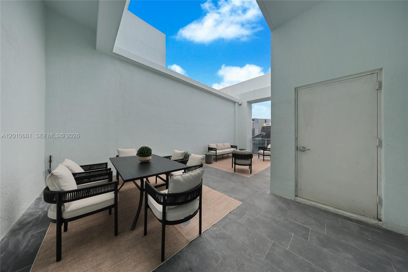 92 Southwest 3rd Street, Unit 5202 Miami, FL 33130 - Photo 21 of 27 a living room with furniture and a potted plant