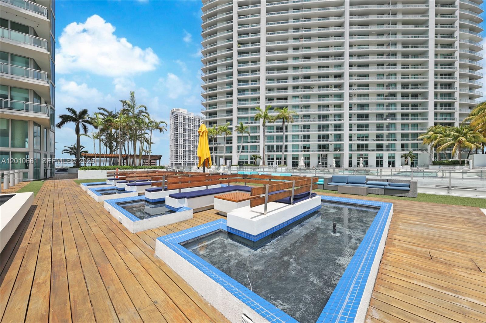 92 Southwest 3rd Street, Unit 5202 Miami, FL 33130 - Photo 25 of 27 a backyard view of a house with outdoor seating
