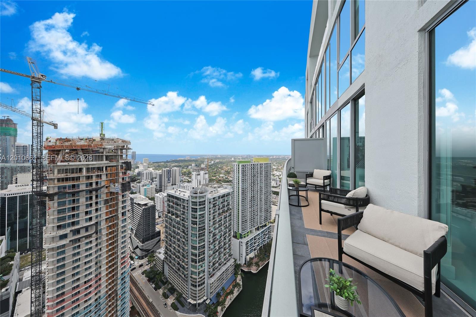 92 Southwest 3rd Street, Unit 5202 Miami, FL 33130 - Photo 10 of 27 a view of a balcony with chairs