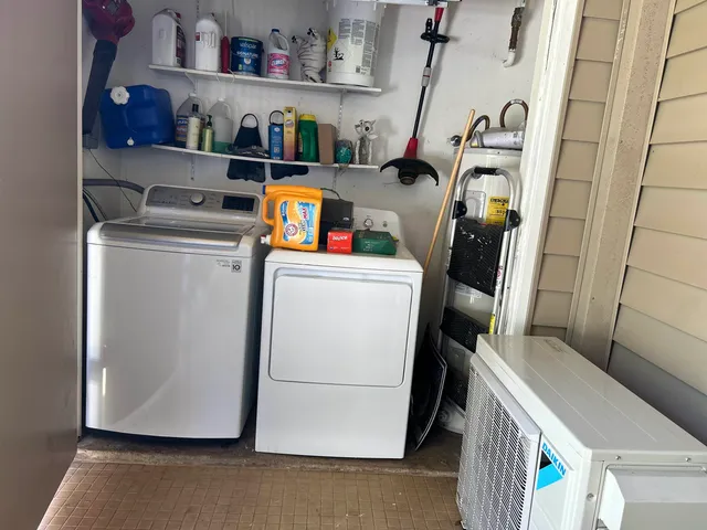 a utility room with dryer and washer