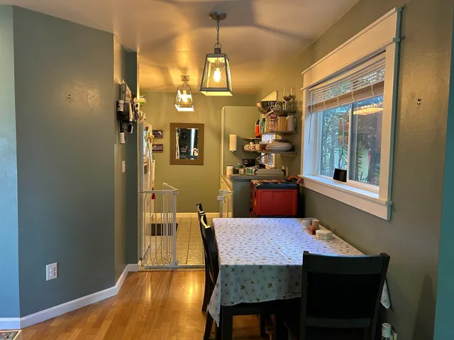 a dining room with furniture and window