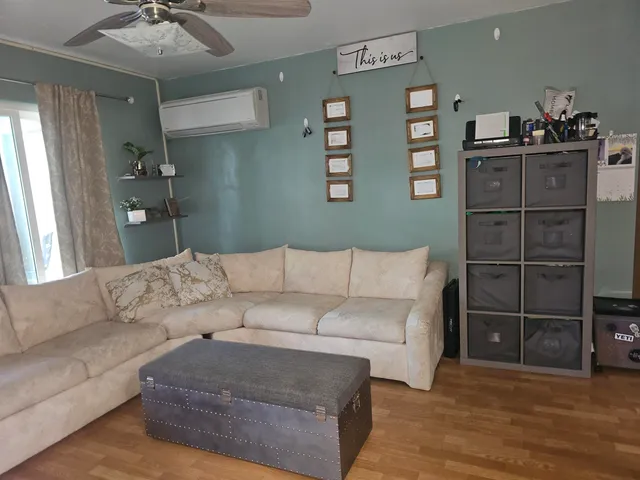 a living room with furniture and natural light