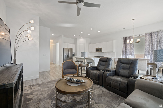 4708 Martin Drive St. George, UT 84790 - Photo 8 of 28 Living room with a chandelier, light wood-style floors, recessed lighting, and ceiling fan