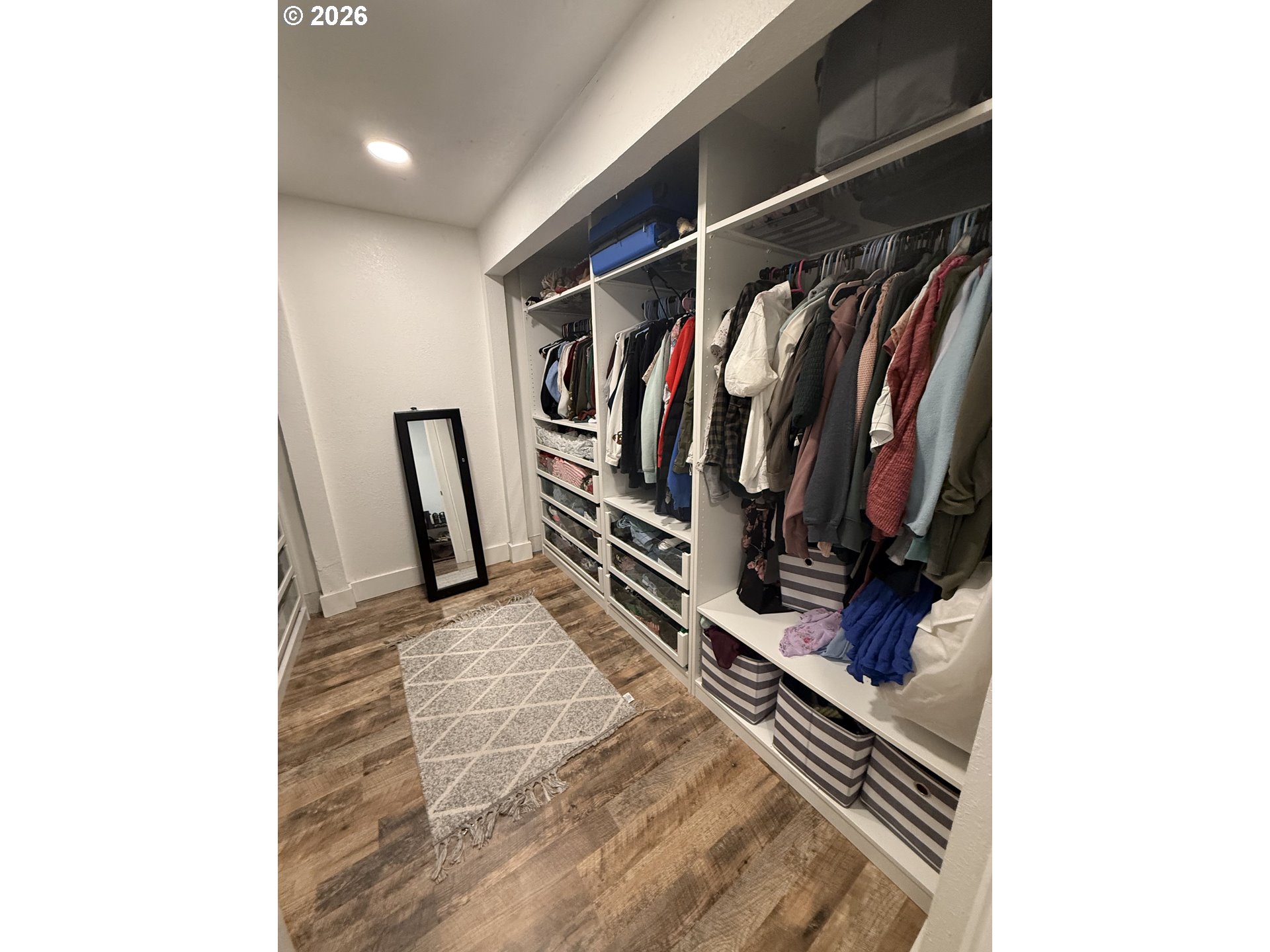6974 Glacier Drive Springfield, OR 97478 - Photo 18 of 37 a view of walk in closet with clothes and shoes