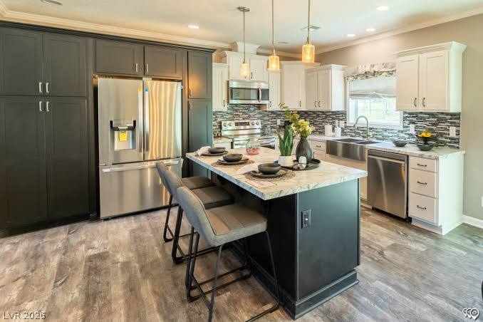 472 Box Canyon Road Alamo, NV 89001 - Photo 5 of 7 Premium stone countertops and a spacious central island anchor this modern dual-tone kitchen.