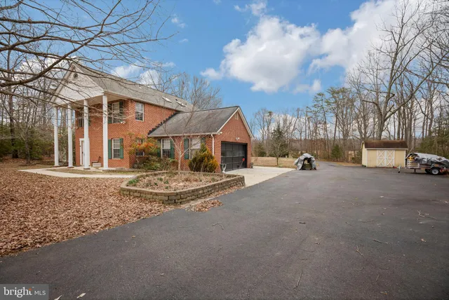 a view of a street with house on both side of the road