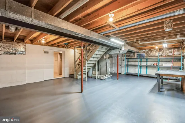 a view of empty room with wooden ceiling