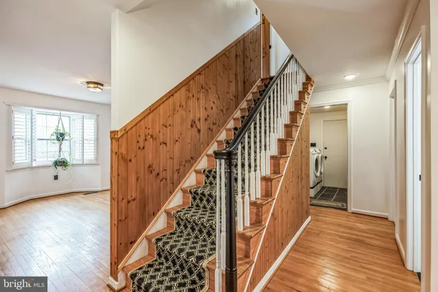 a view of an entryway wooden floor and interior