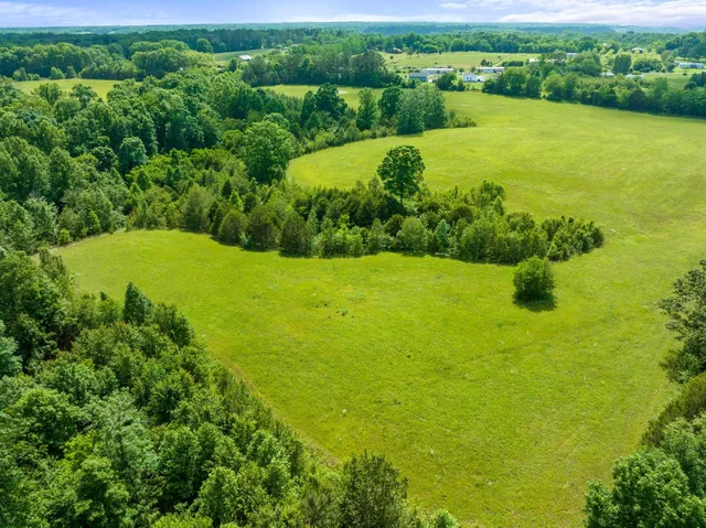 a view of a golf course with parking space