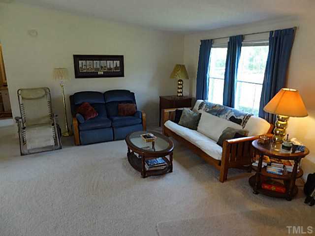 175 MacBeth Lane Roxboro, NC 27574 - Photo 7 of 24 The oversized 16x16 LIVING ROOM offers plenty of sunlight and a cathedral ceiling.