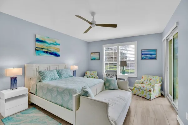 a bedroom with a bed and a couch