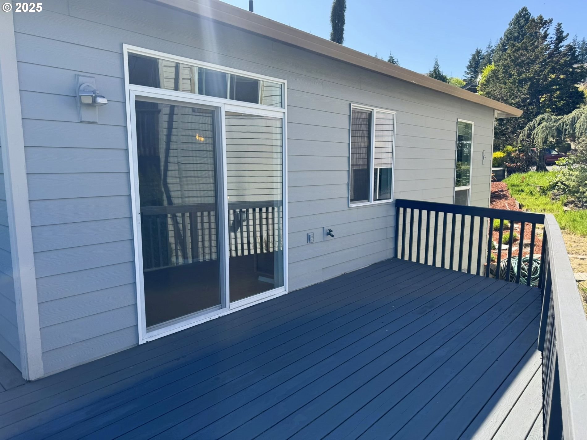 13728 Southwest 130th Place Portland, OR 97223 - Photo 17 of 24 a view of wooden balcony and front door