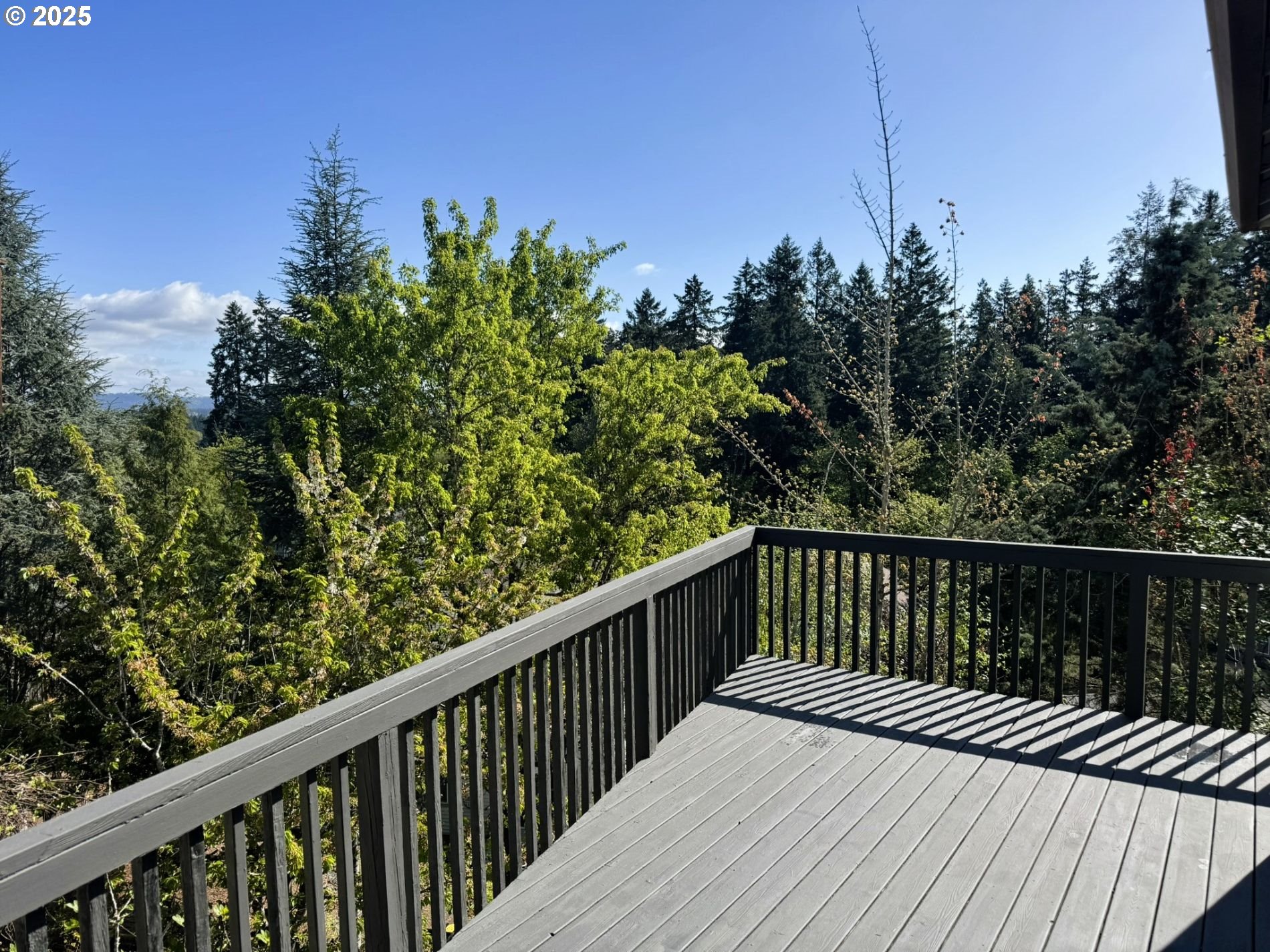 13728 Southwest 130th Place Portland, OR 97223 - Photo 18 of 24 a balcony with wooden floor and fence