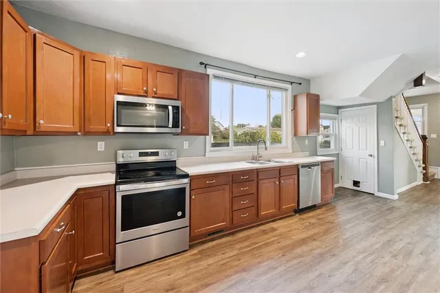 a kitchen with a sink and a window