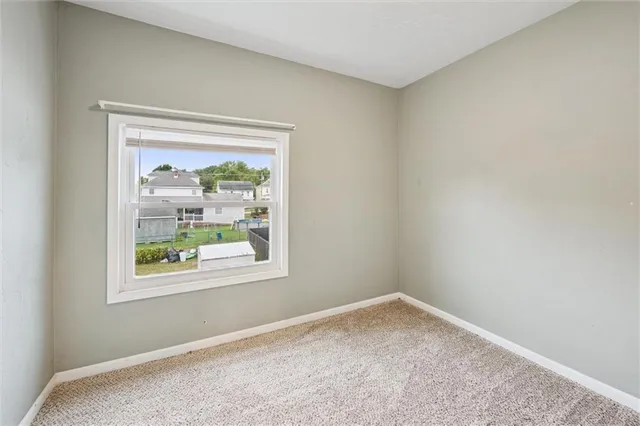 a bathroom with a sink and mirror with toilet