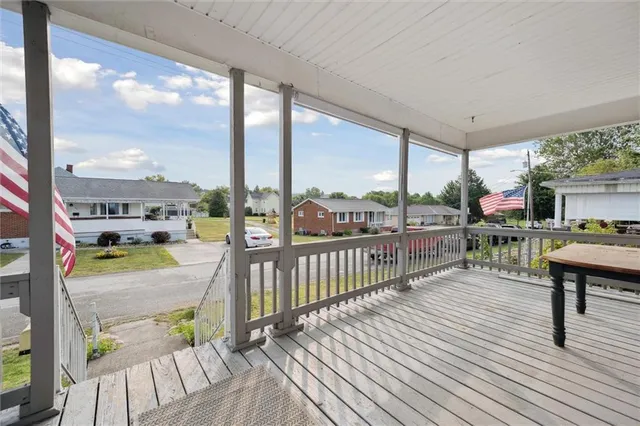 a balcony with furniture and a table