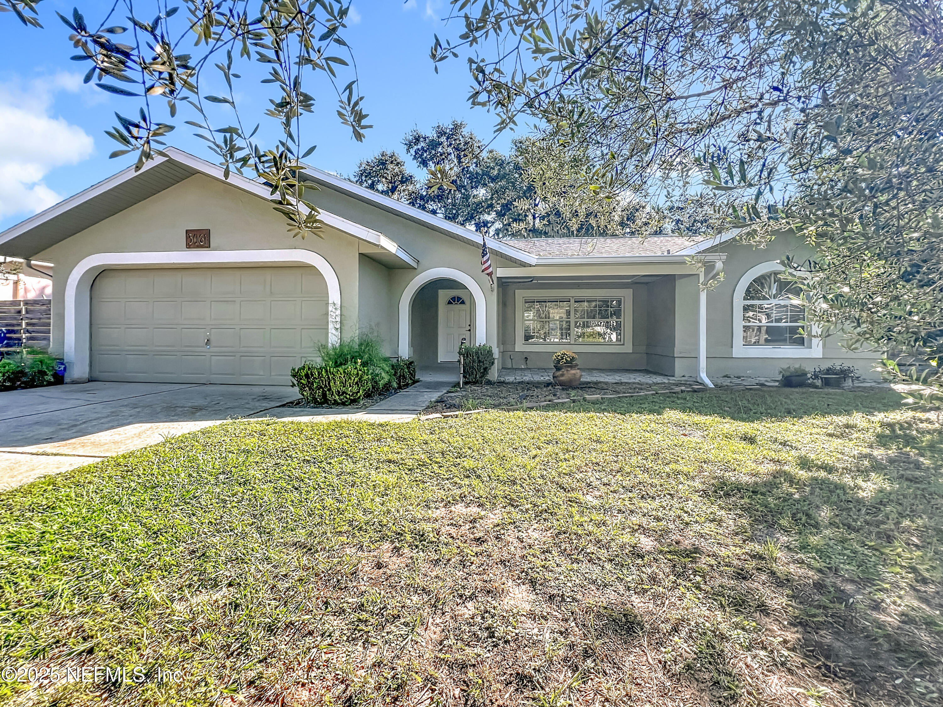 3061 South Franklin Terrace Inverness, FL 34450 - Photo 2 of 65 a front view of a house with garden