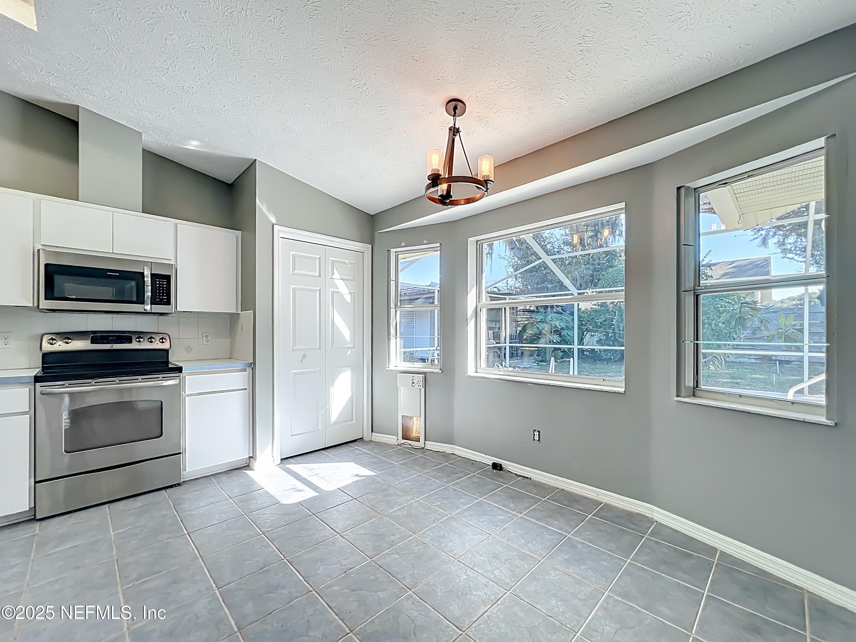 3061 South Franklin Terrace Inverness, FL 34450 - Photo 25 of 65 a view of kitchen with a stove cabinets and a open kitchen